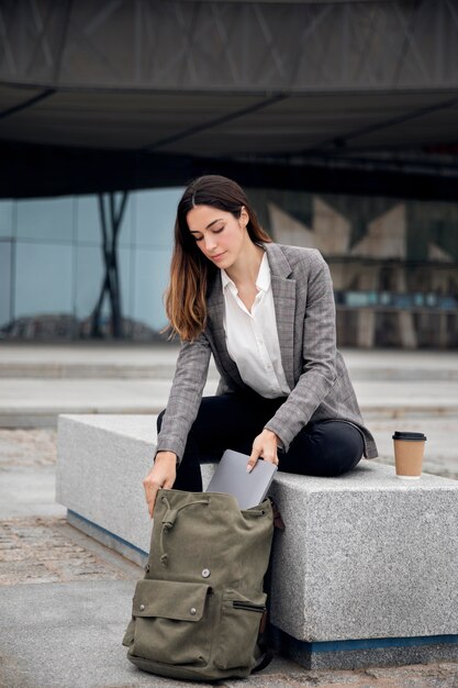 Full shot woman with backpack