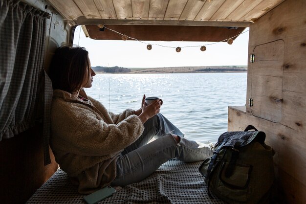 Free Photo full shot woman with beautiful view
