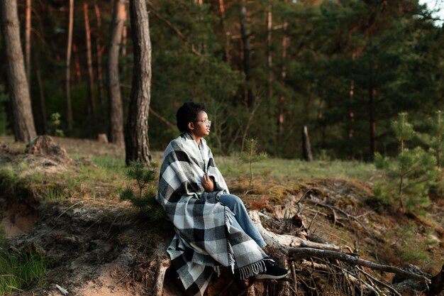 Full shot woman with blanket