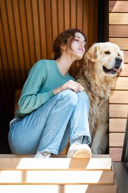 Full shot woman with cute dog