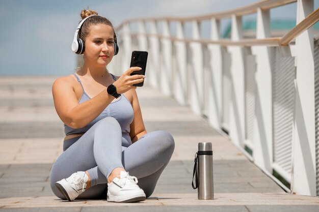 Full shot woman with headphones