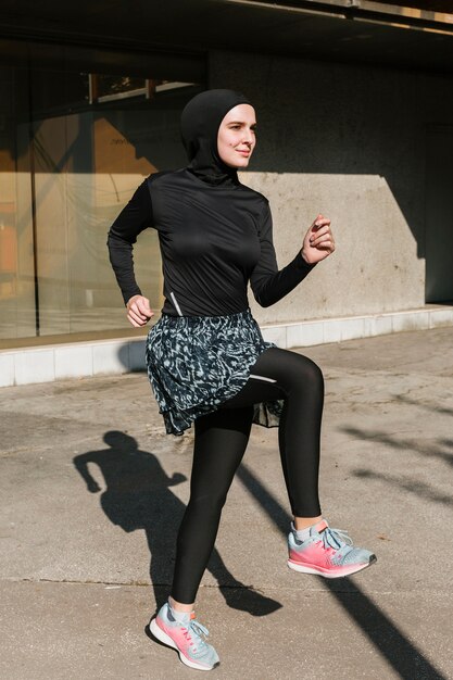 Full shot of woman with hijab training