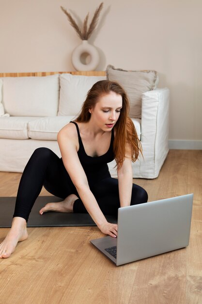 Full shot woman with laptop