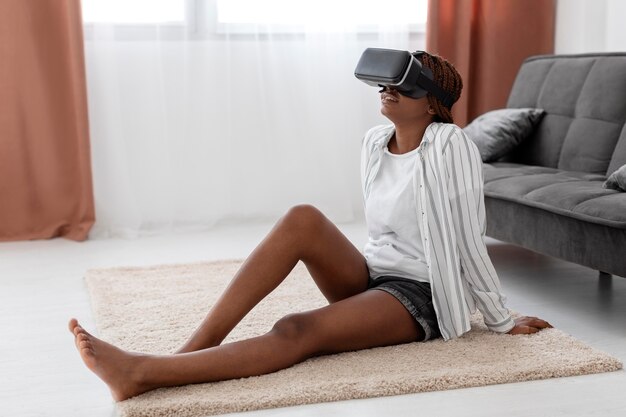 Full shot woman with vr glasses