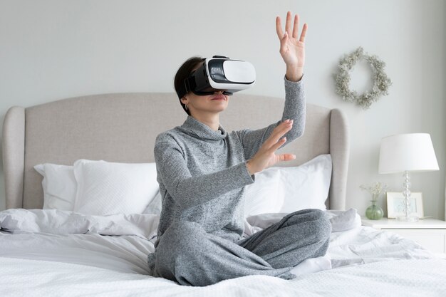 Full shot woman with vr glasses