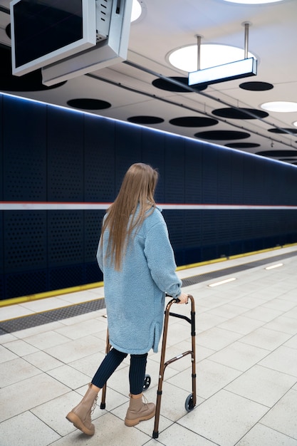 Full shot woman with walking frame