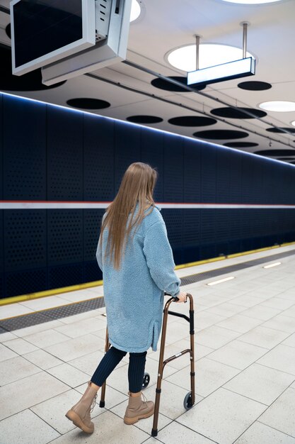 Full shot woman with walking frame