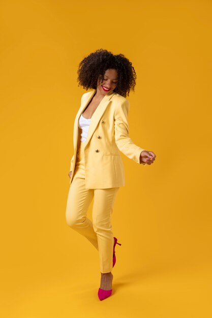 Full shot woman with yellow suit