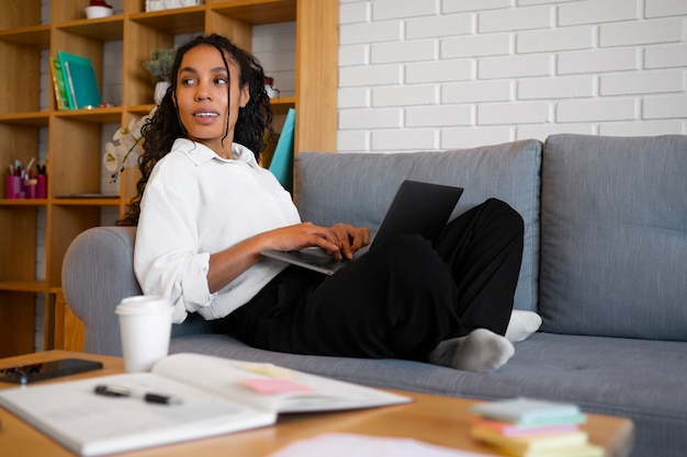 Full shot woman working as an economist