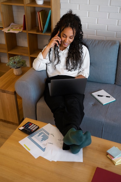 Full shot woman working as an economist