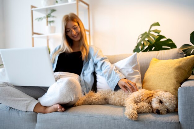 Full shot woman working on couch