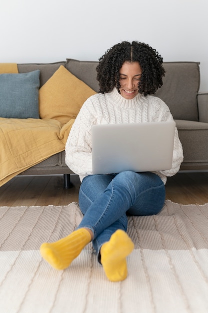 Full shot woman working from home