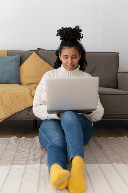 Full shot woman working from home