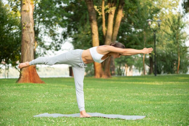 Full shot woman yoga posture