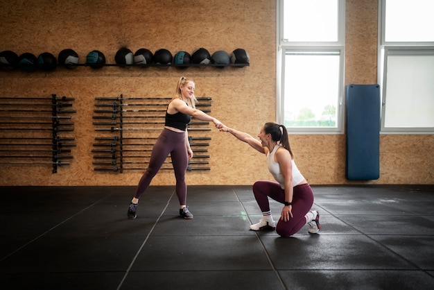 Full shot women fist bump