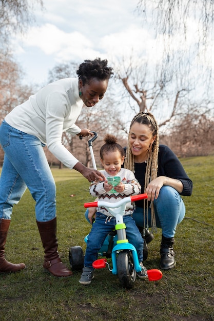 Full shot women and girl in park