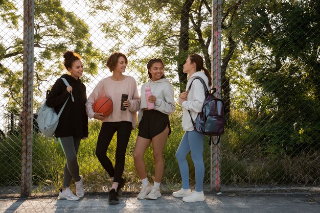 Full shot women playing basketball