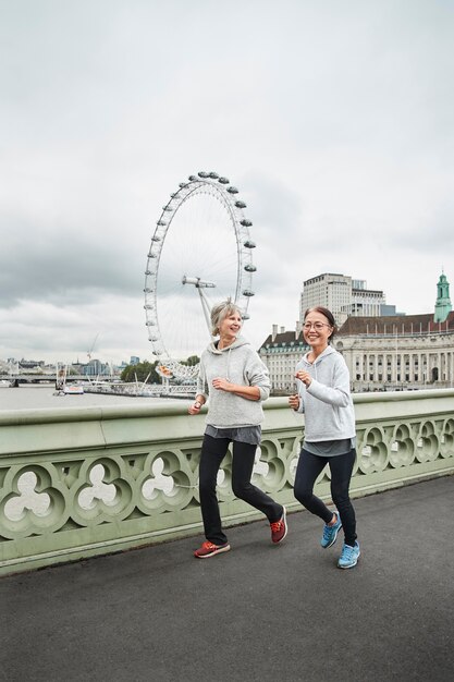 Full shot women running together