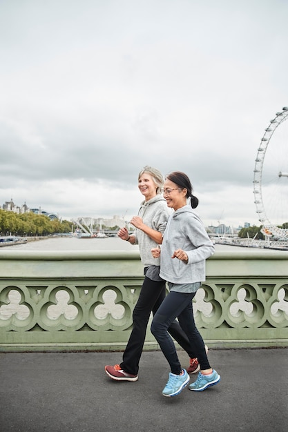 Full shot women running together