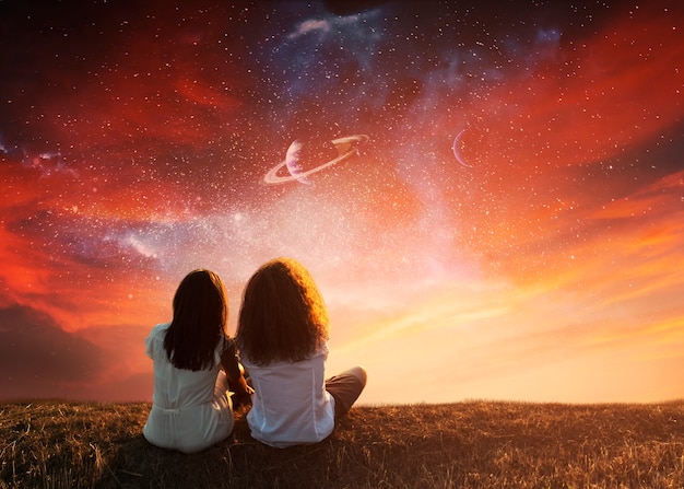 Free photo full shot women sitting on meadow