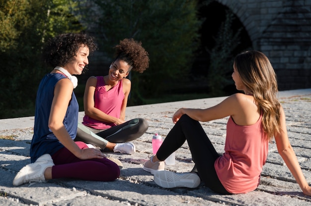 Full shot women sitting together