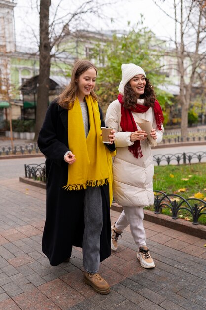 full shot women walking outdoors