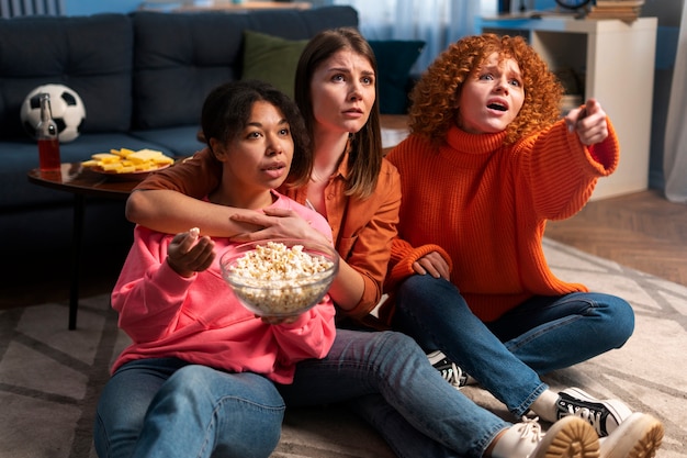 Full shot women watching sports