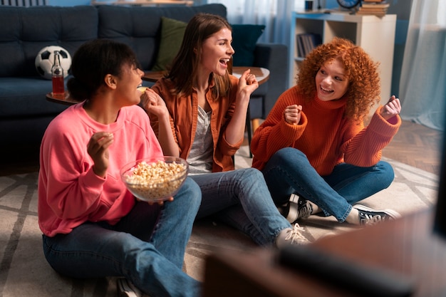 Full shot women watching sports