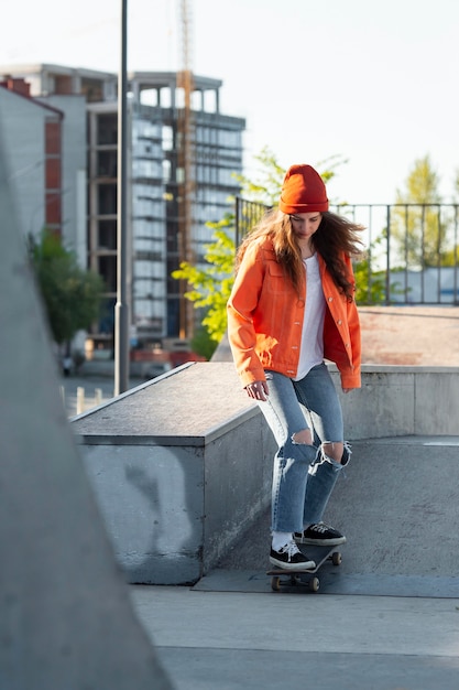 Full shot young girl skating