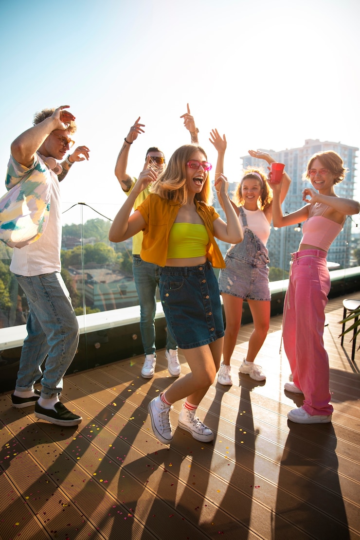 Free Photo full shot young people partying outdoors