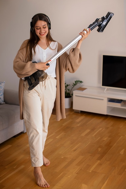 Full shot young woman spending time at home