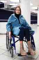 Free photo full shot young woman in wheelchair