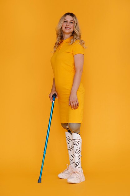 Full shot young woman with prosthesis