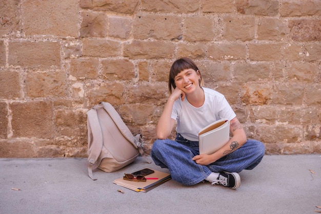 Free photo full view of cheerful woman smiling at camera