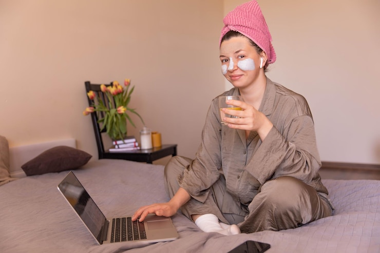 Free Photo full view of woman talking care of skin look at camera