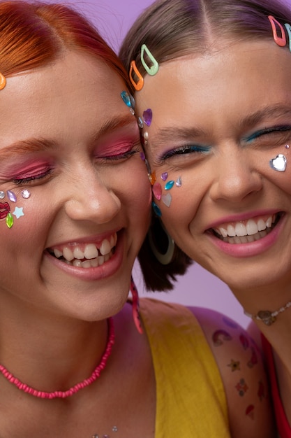 Fun friends portrait with decorations on face