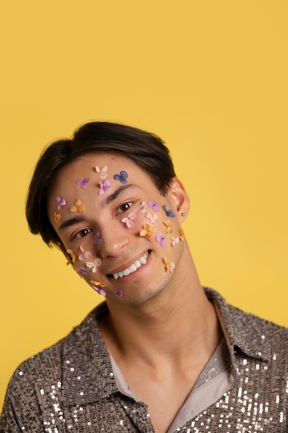 Fun portrait with glued decorations on face