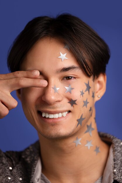 Free photo fun portrait with glued decorations on face