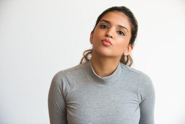 Funny attractive Indian girl with puckered lips