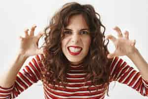 Free photo funny attractive woman fool around, acting like monster