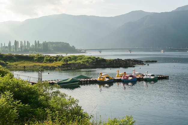 Funny boats tied up to a wooden jetty