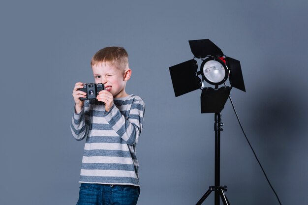 Funny boy with camera