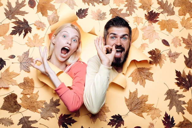 Funny couple are getting ready for autumn sale funny fac  happy family in autumn