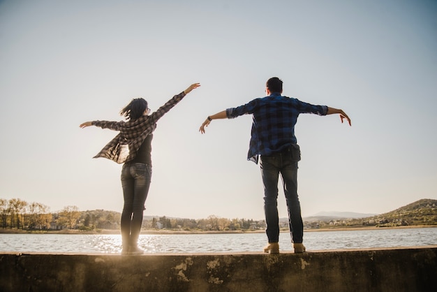 Free photo funny couple playing with their arms