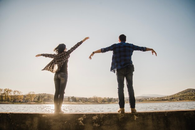 Funny couple playing with their arms