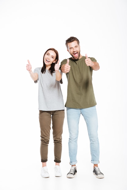 Funny couple showing thumbs up