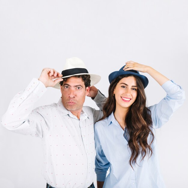 Funny father and daughter in hats