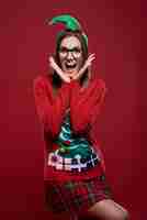 Free photo funny female nerd dressed in christmas clothes