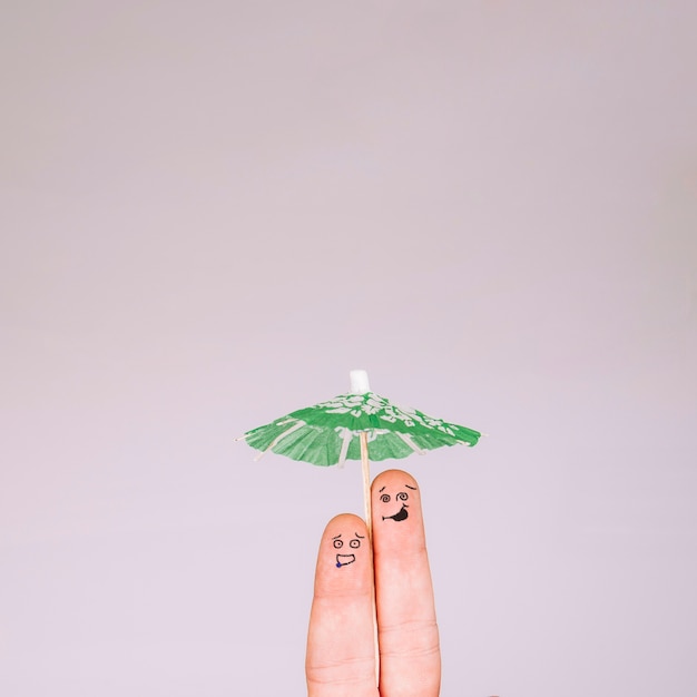 Funny fingers under umbrella