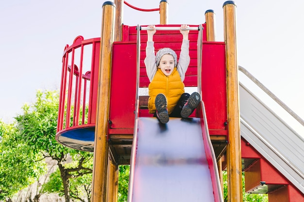 Funny girl on slide